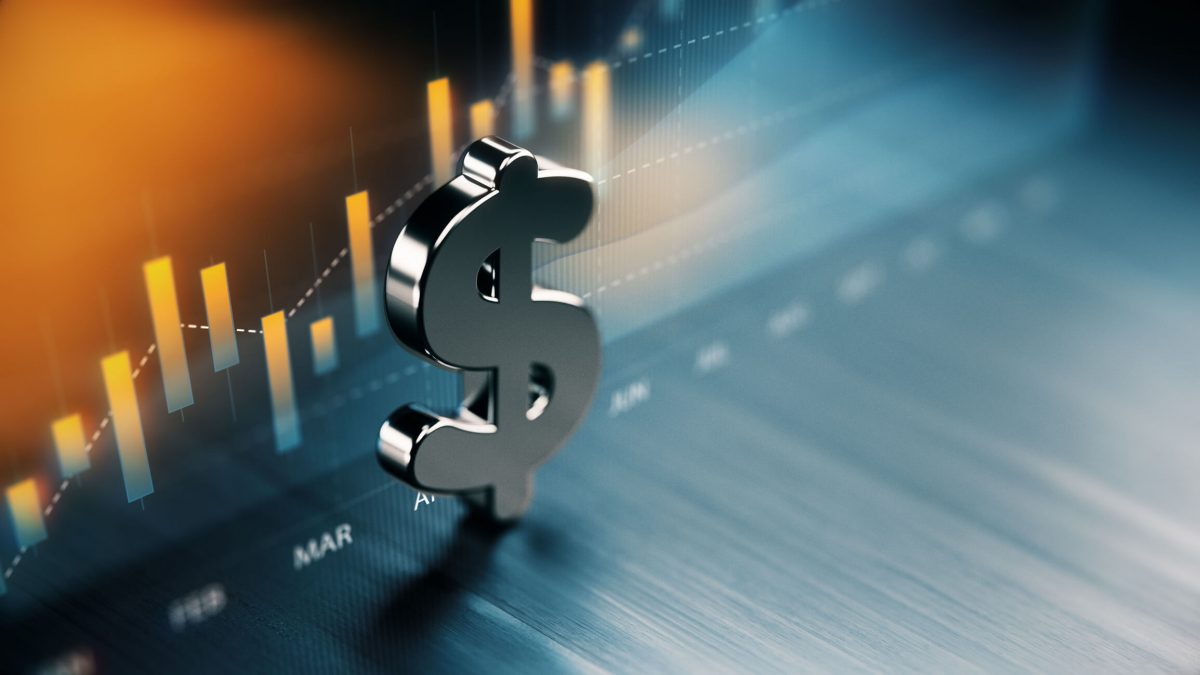 Metallic dollar sign in front of a rising financial bar chart